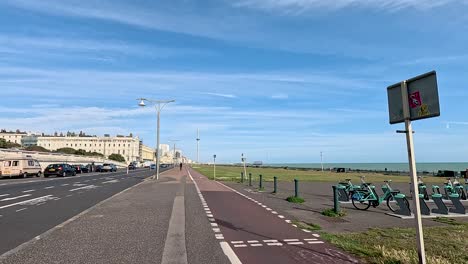 cyclists riding along brighton seafront bike path