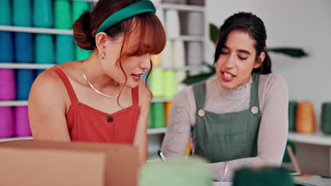 two women collaborating in a sewing studio