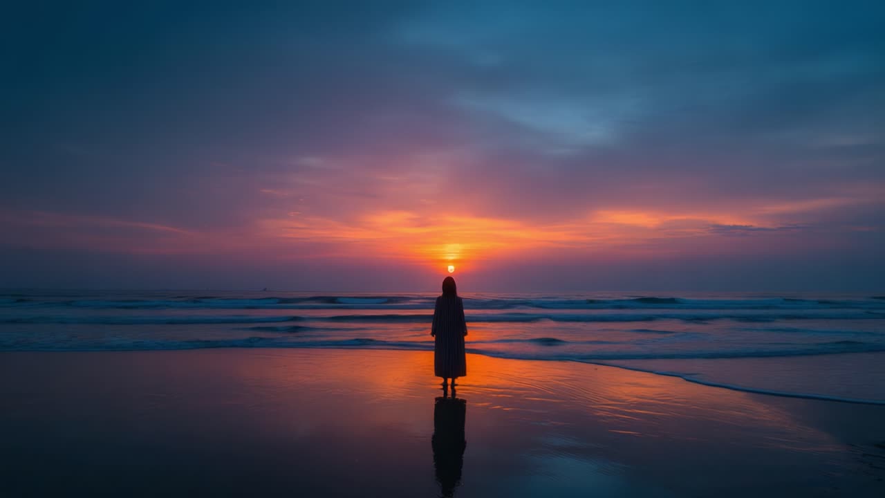 A Serene Sunset by the Ocean: A Figure in Silhouette Standing Quietly on the Shore, Witnessing the Beautiful Transition of Day to Night Amidst a Vibrant Sky
