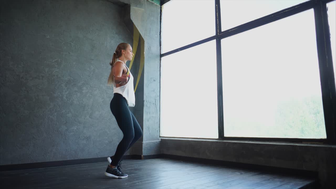 Woman Jumping Rope in Fitness Studio