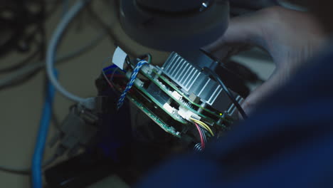 caucasian scientist looking into a microscope in the laboratory at microchips