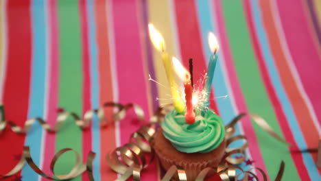 birthday cupcake with sparkler and candle