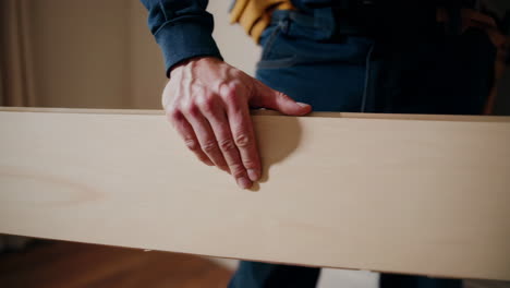 man installing wood flooring