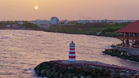 small lighthouse at sunset by hilton garden inn hotel at la romana in dominican republic