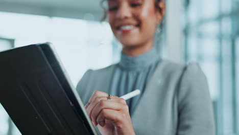 woman using a tablet with a digital pen in an office