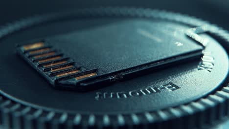 A-macro-close-up-shot-of-an-SD-memory-card,-black-gold,-on-a-360-rotating-stand,-cinematic-studio-lighting,-120-fps-slow-motion,-Full-HD