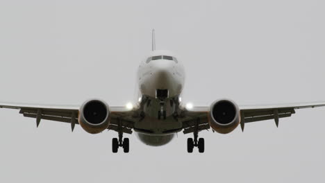 frontal view of passenger airplane landing