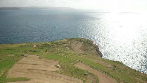 AERIAL:-Ta-Cenc-Cliffs-Meets-Blue-Mediterranean-Sea-on-Bright-Windy-Winter-Day