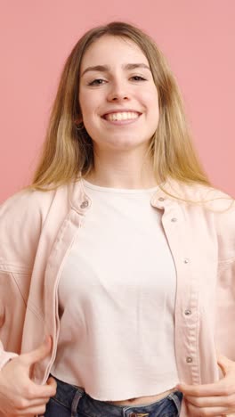 young woman expressing different emotions on pink background