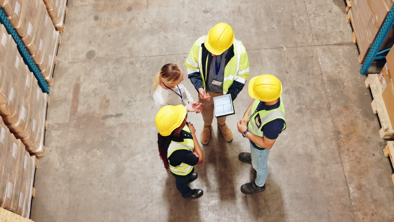 Warehouse team planning with a tablet