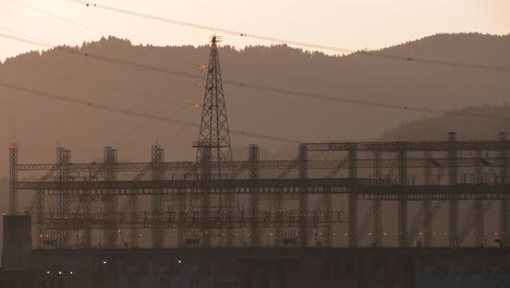 high tension power lines in sunset light