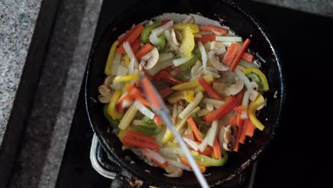 stir-frying colorful vegetables