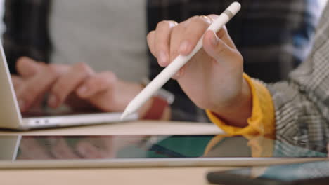 close up hands business woman using digital tablet computer showing businessman information poitnting stylus pen at screen on mobile touchscreen device