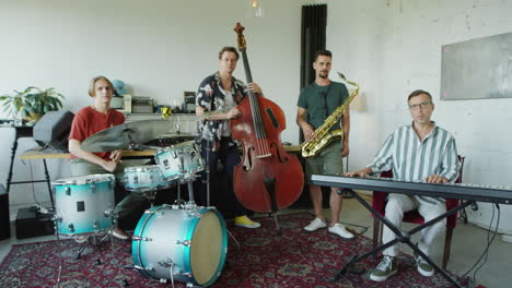 a group of musicians with their instruments in an indoor setting