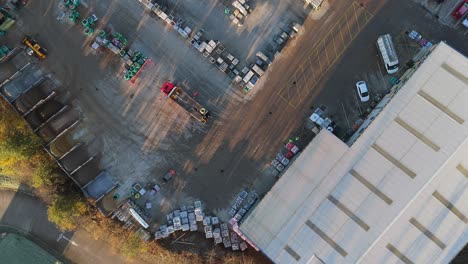 Overhead-drone-aerial-footage-of-industrial,-commercial,-yard