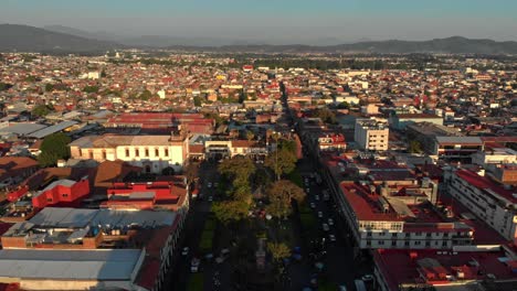 drone shot of uruapan, michoacán downtown at sunset