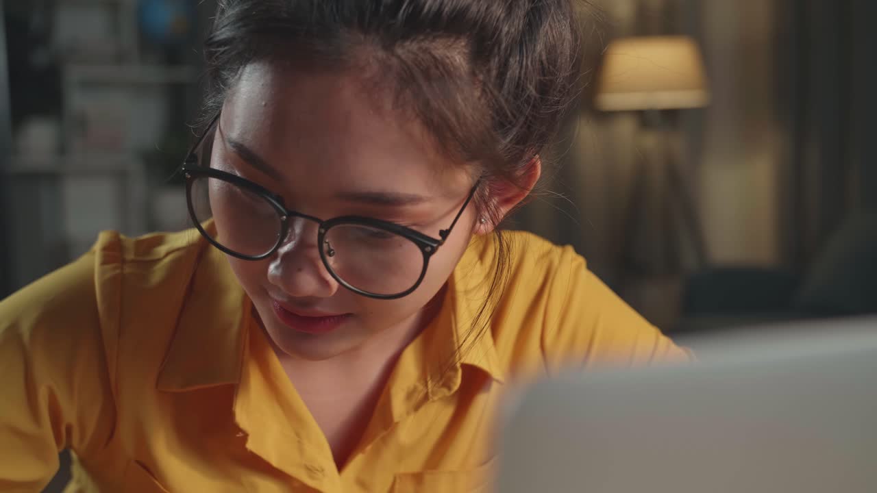 Close Up Asia Girl Learning Online Or Working From Laptop At Night