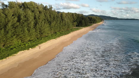 Aerial-over-a-long-and-pristine-sandy-beach-near-Khao-Lak,-Phang-nga,-Thailand