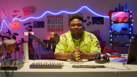 portrait of african american musician in audio studio