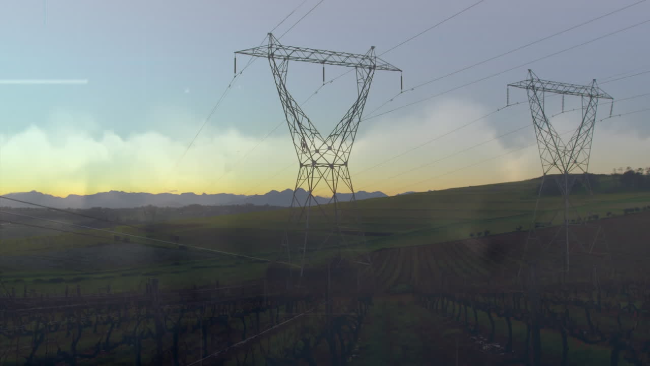 Animation of data processing over landscape with electricity pylons
