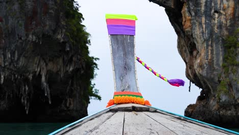 boat navigating through krabi's scenic cliffs