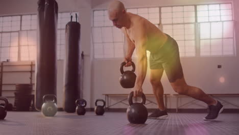 lifting kettlebells, man exercising in gym with light effects animation