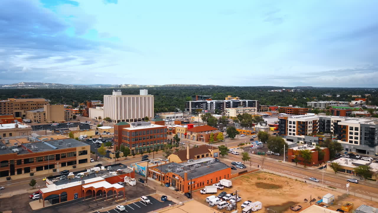 Colorado Springs, USA, 22 July 2025: Urban scenery of modern Colorado Springs, Colorado, USA. Hectic traffic in the downtown of the city. Lush greenery at backdrop
