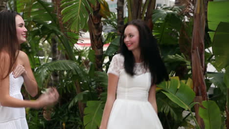 pretty friends admiring their dresses