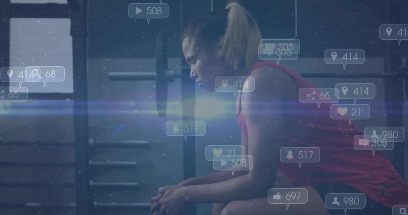 Woman athlete catching breath after bench pressing in gym, social media icons flooding then fading