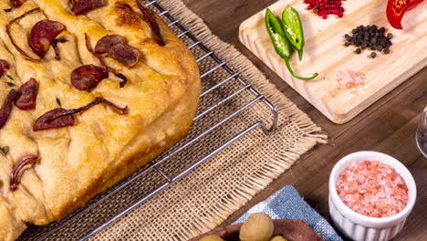 traditional italian focaccia with pepperoni, cherry tomatoes, black olives, rosemary ando onion - homemade flat bread focaccia