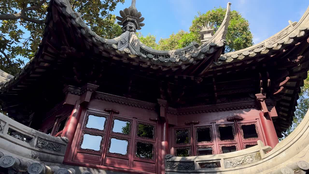 historic pavilion showcasing intricate eaves and classic Shanghai garden architecture