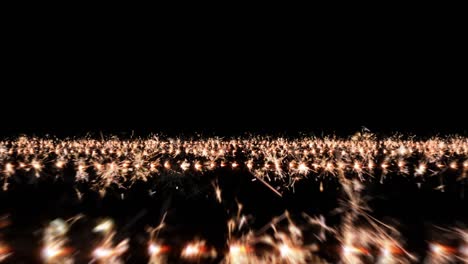 camera flies over rows of sparklers, black background.