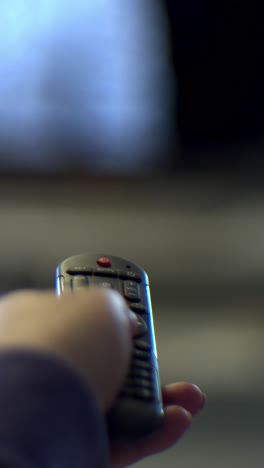 hand turns off the tv by remote control