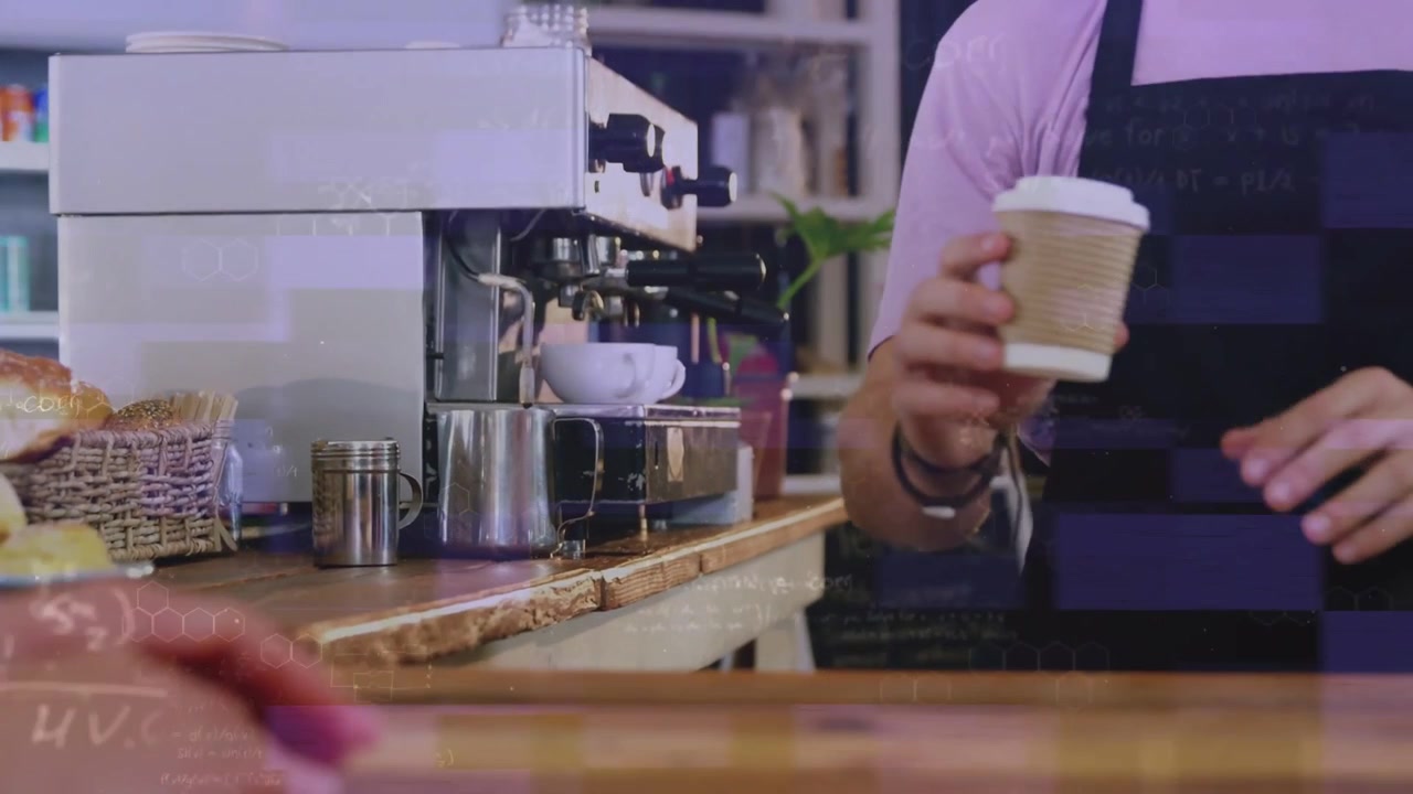 Vertical video: Barista in coffee shop placing cup under group head and pulling shot for takeaway