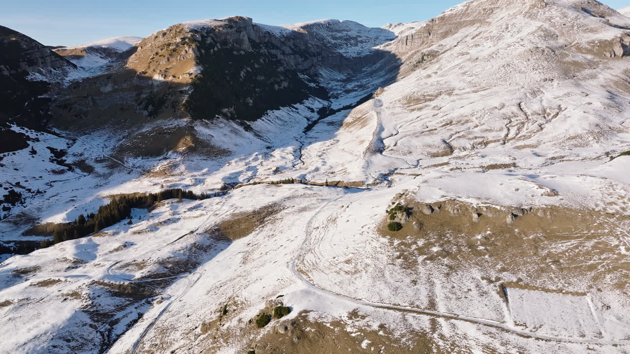 Aerial drone view of a little snow on the Bucegi Mountains, near Brasov, Romania