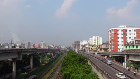 urban cityscape view of dhaka, bangladesh with overpasses and railway tracks