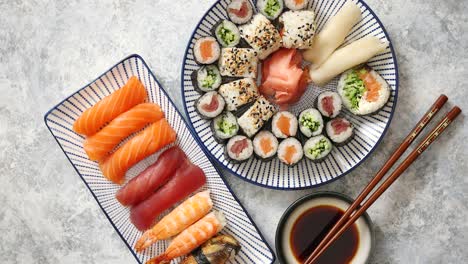 Asian-food-assortment--Various-sushi-rolls-placed-on-ceramic-plates