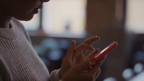 close up of womans hands using smart phone technology