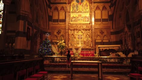 young woman praying at a cathedral