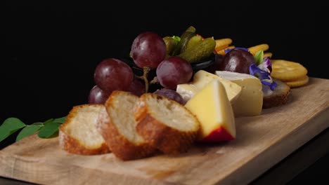 cheese and fruit platter with bread and crackers