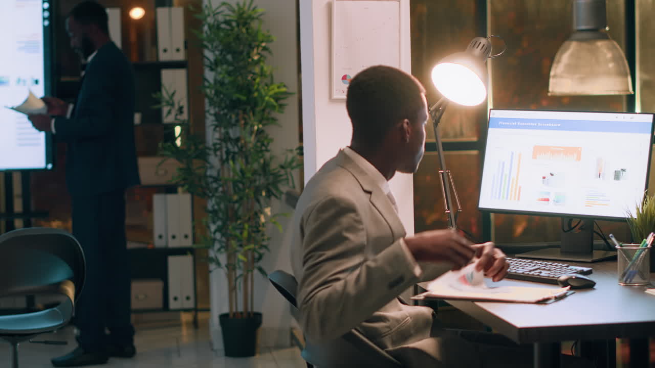 Man working on financial analysis in modern office