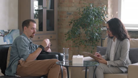 man with mental health problems talking to therapist