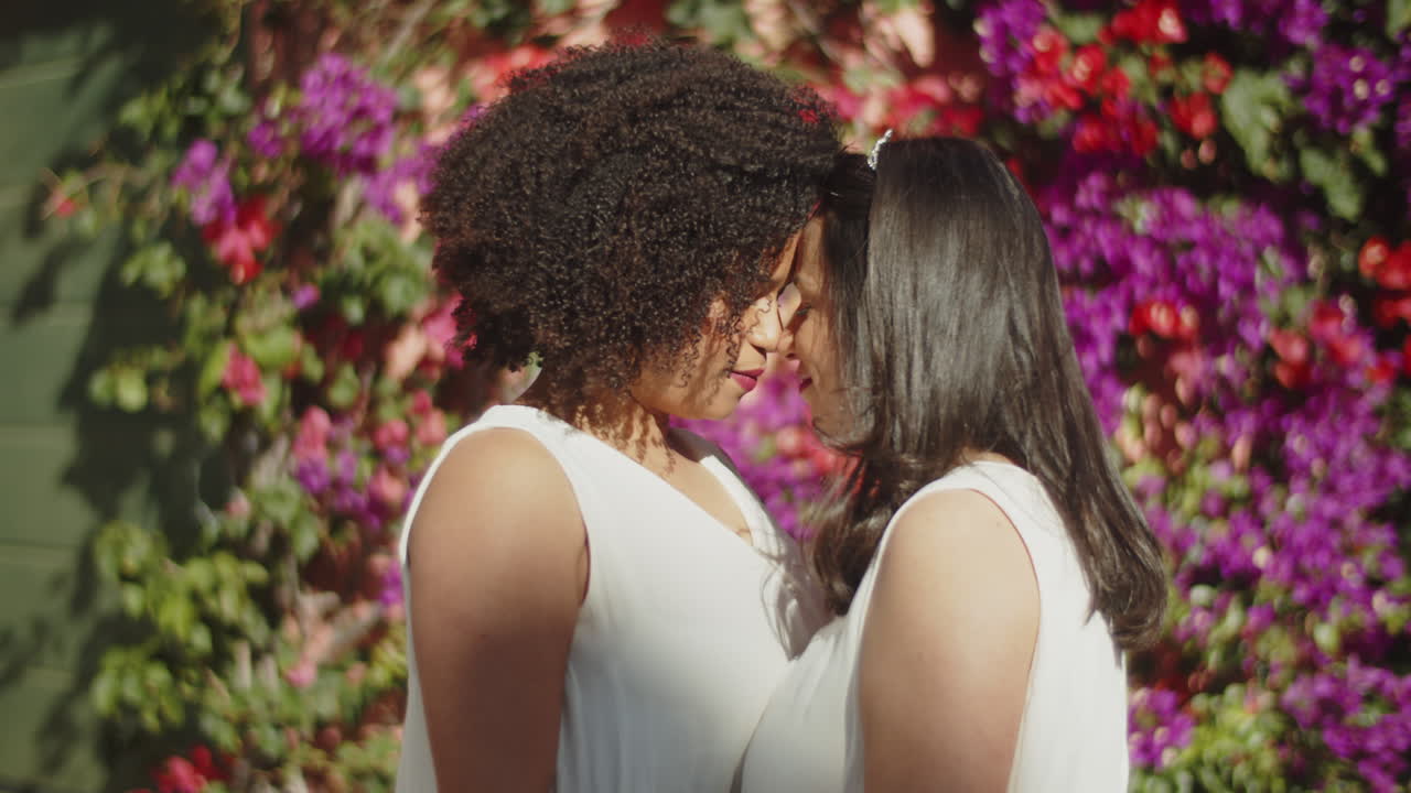 Free stock video - Handheld shot of lesbian couple hugging before wedding  ceremony