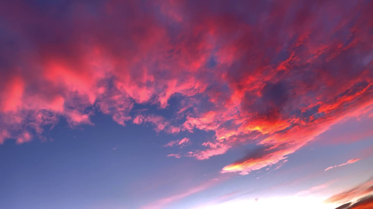 Epic blue purple Sky With Fire Red Clouds during sunset, time lapse shot