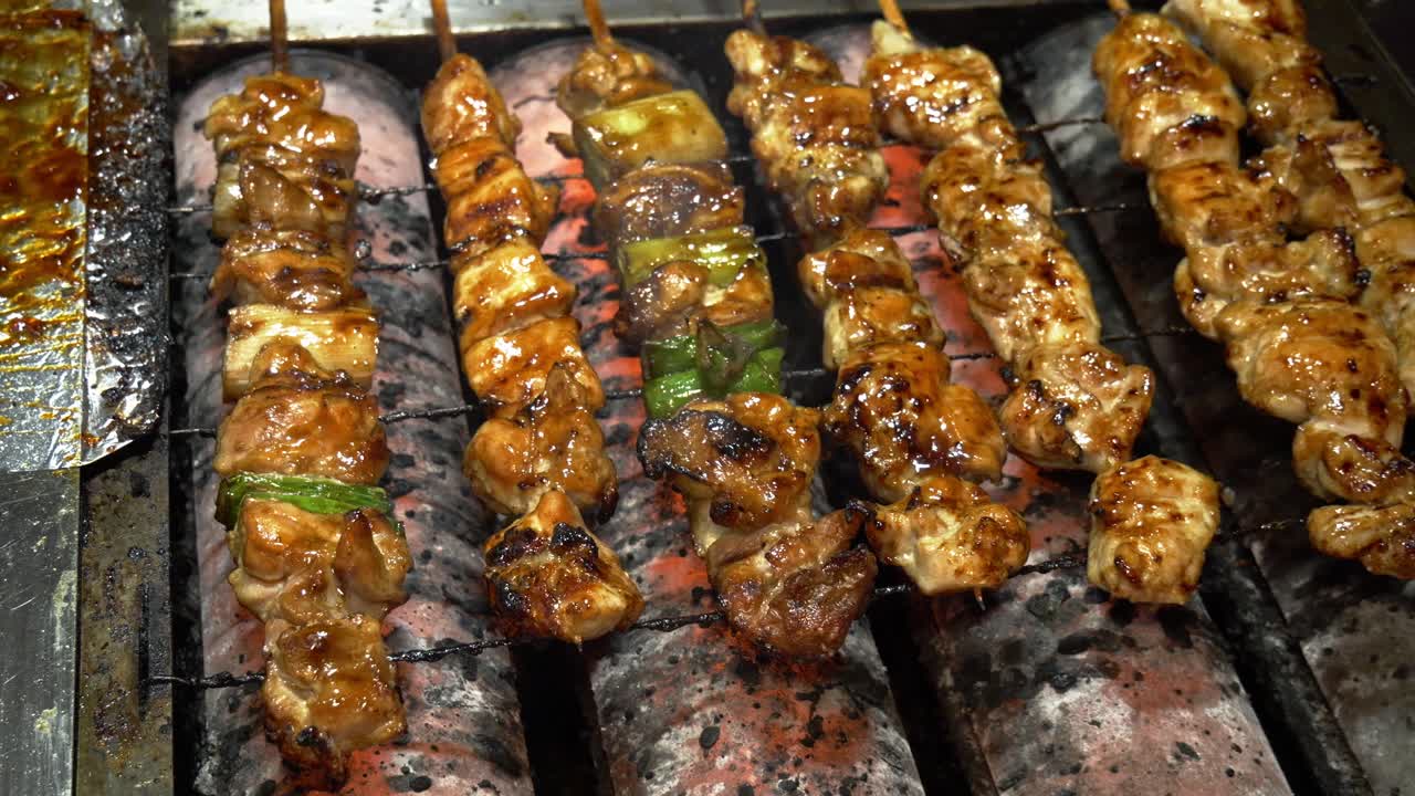 Skewers Of Glazed Meat And Vegetables Grilling Outdoors. Street Food In Daejeon, South Korea. closeup shot