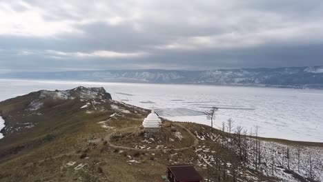 frozen lake baikal with buddhist temple