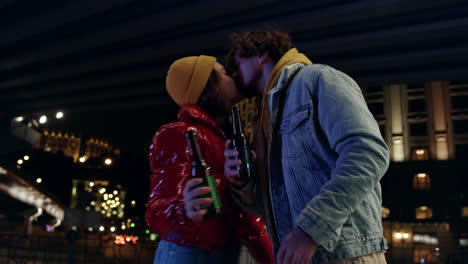 cheerful couple drinking at broodershaft on street. man and woman enjoying date.