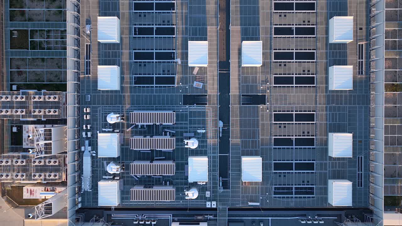 Modern data center building roof with telecommunication antennas, HVAC units, server facility, Warsaw, Revealing drone shot