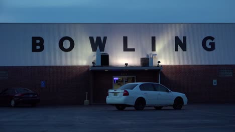 establishing shot of a bowling alley at night