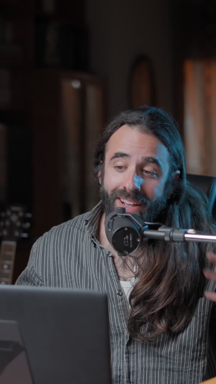 Man recording a podcast or live stream from his home studio